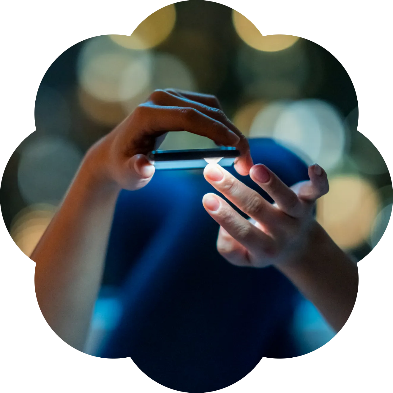 Person's hands scrolling on a phone